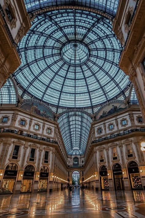 A grand arched arcade with a glass roof